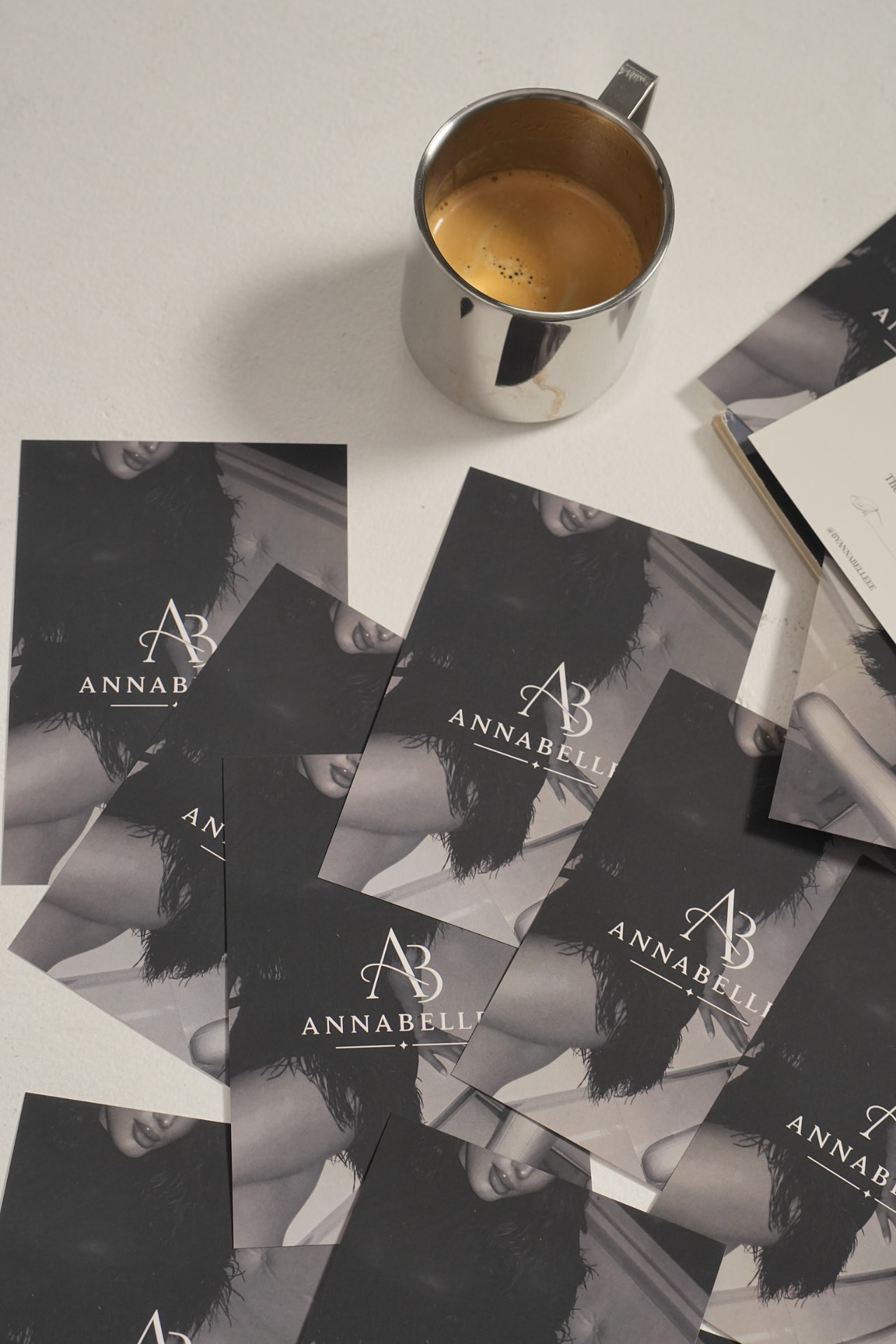Annabelle brand cards arranged with coffee